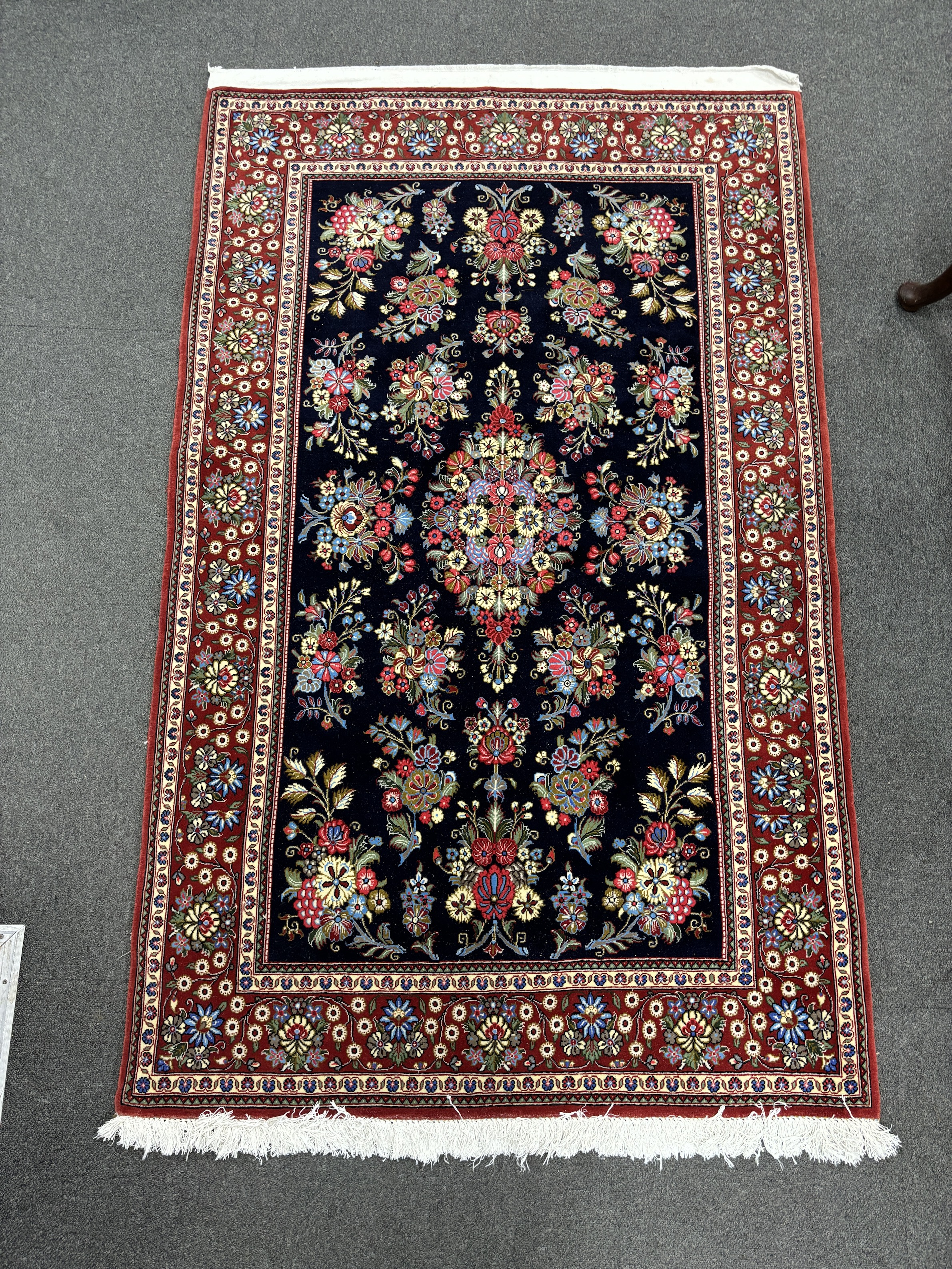 A North West Persian blue ground medallion rug, 164 x 103cm